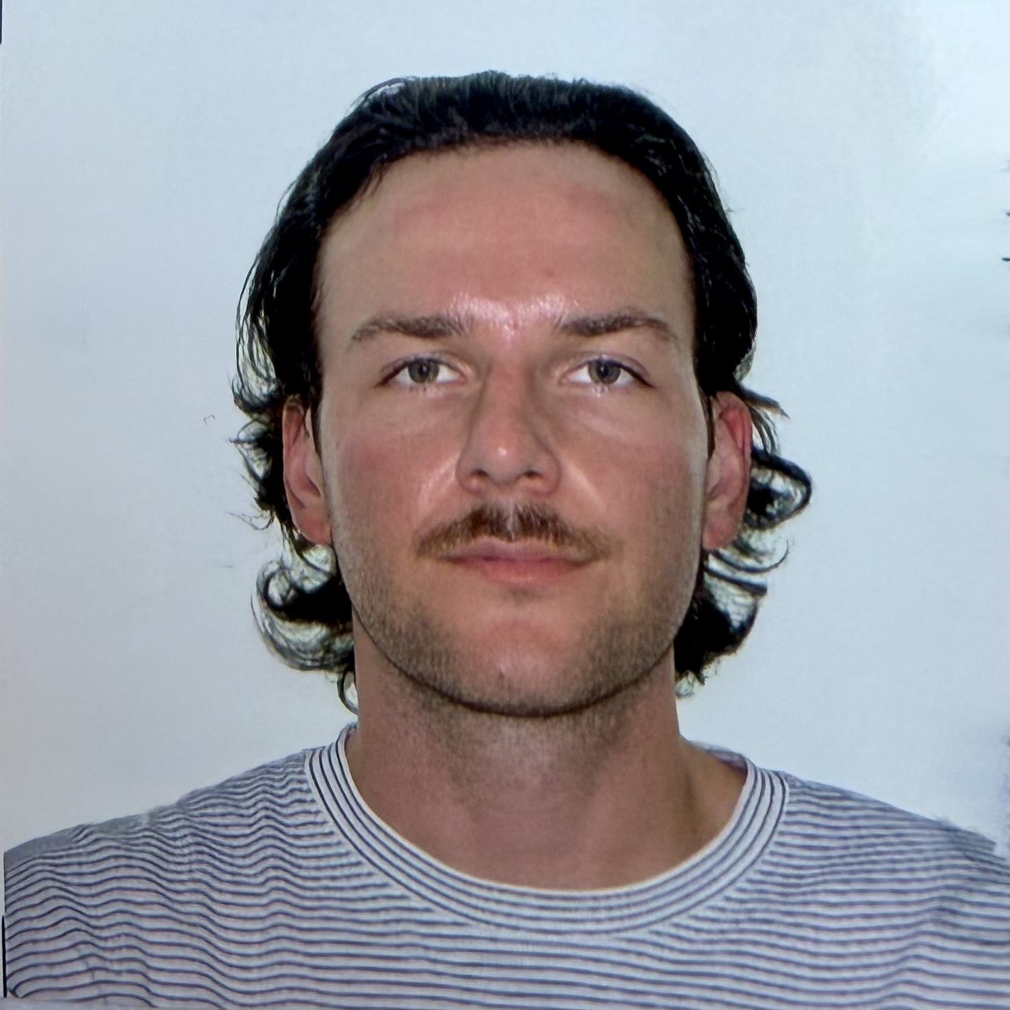 Headshot of Alex Szrol against a white background