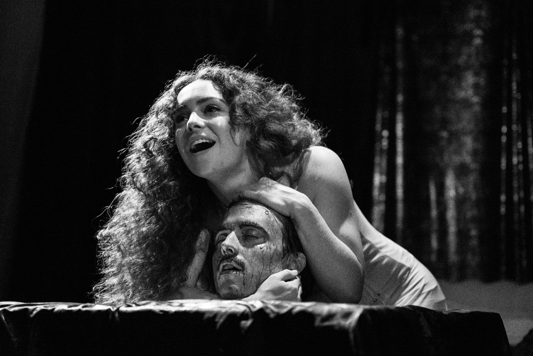 Salome holds the head of Yokanaan in a black-and-white DECAPITATRIX production photo