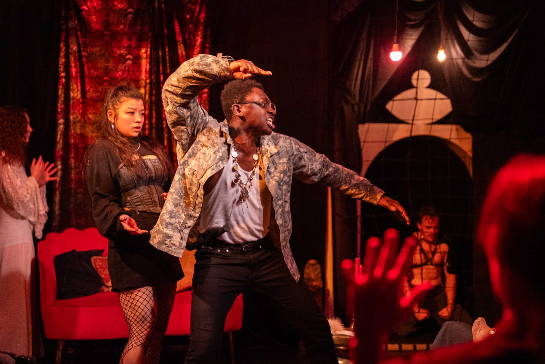 Tigellinus performs in the red-lit DECAPITATRIX room