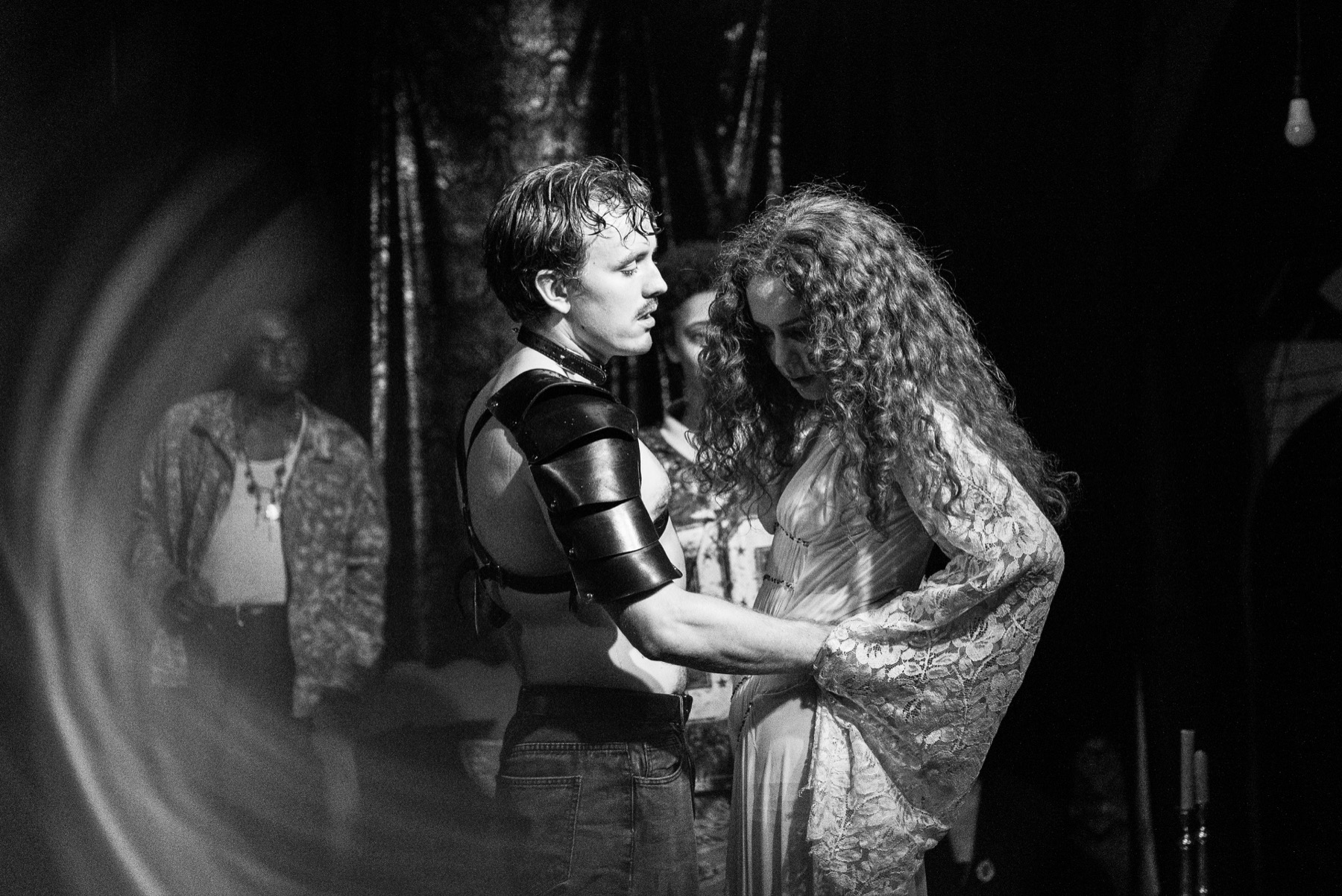 Yokanaan and Salome stand close together in a black-and-white DECAPITATRIX production photo