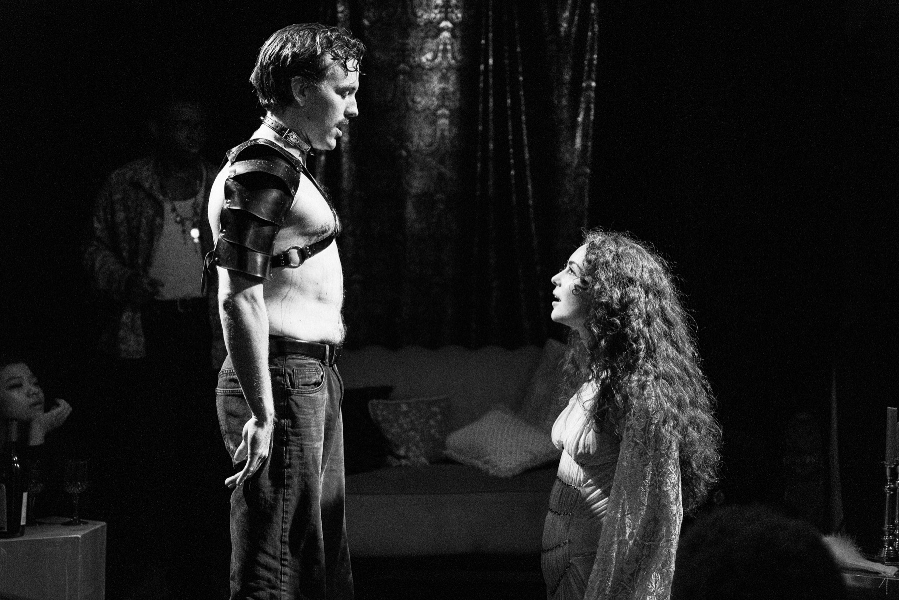 Yokanaan stands over Salome in a black-and-white DECAPITATRIX production photo