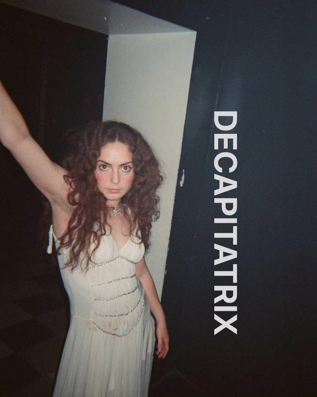 Decapitatrix promo image of Salome against a dark wall