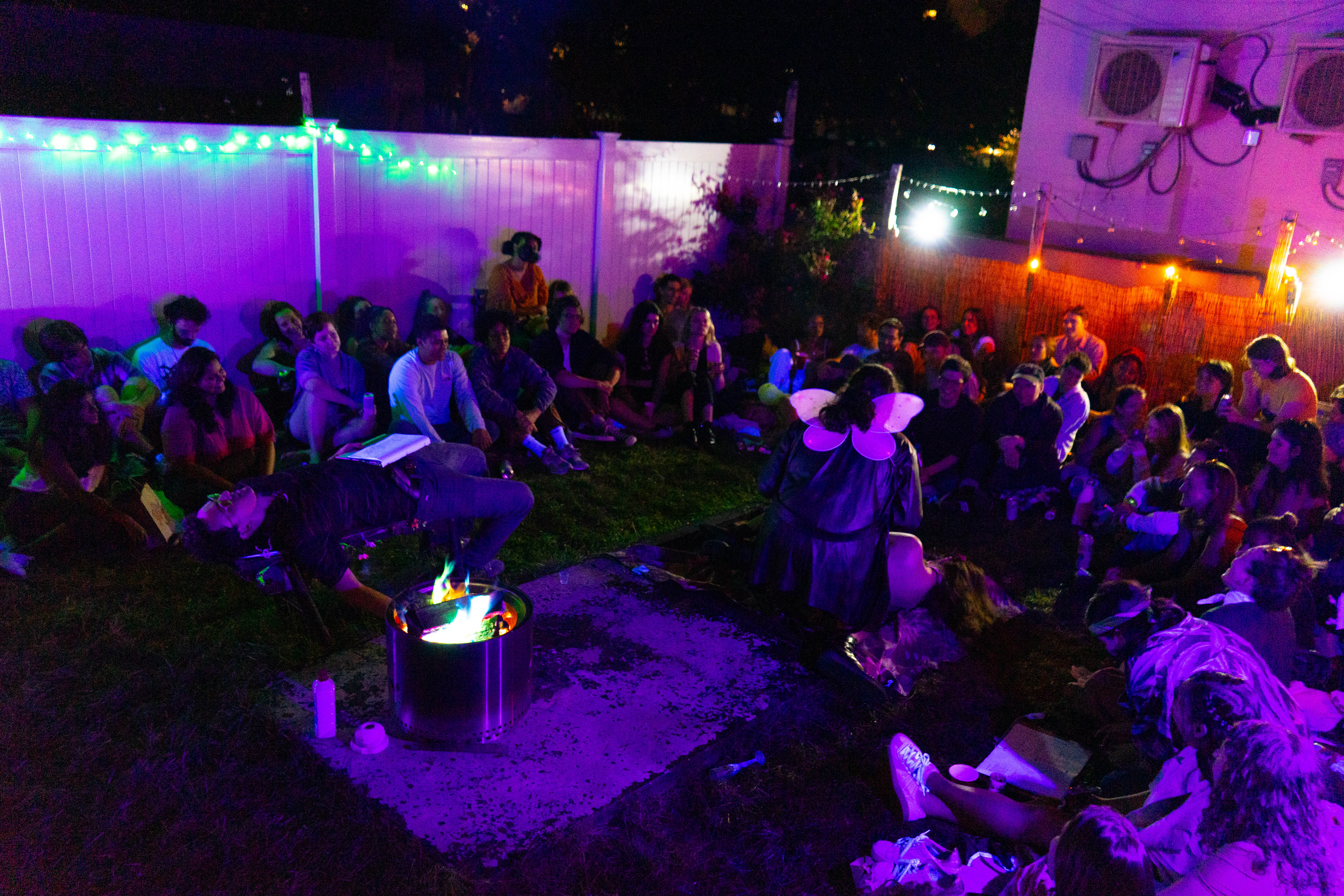 Late summer party atmosphere with performers and audience