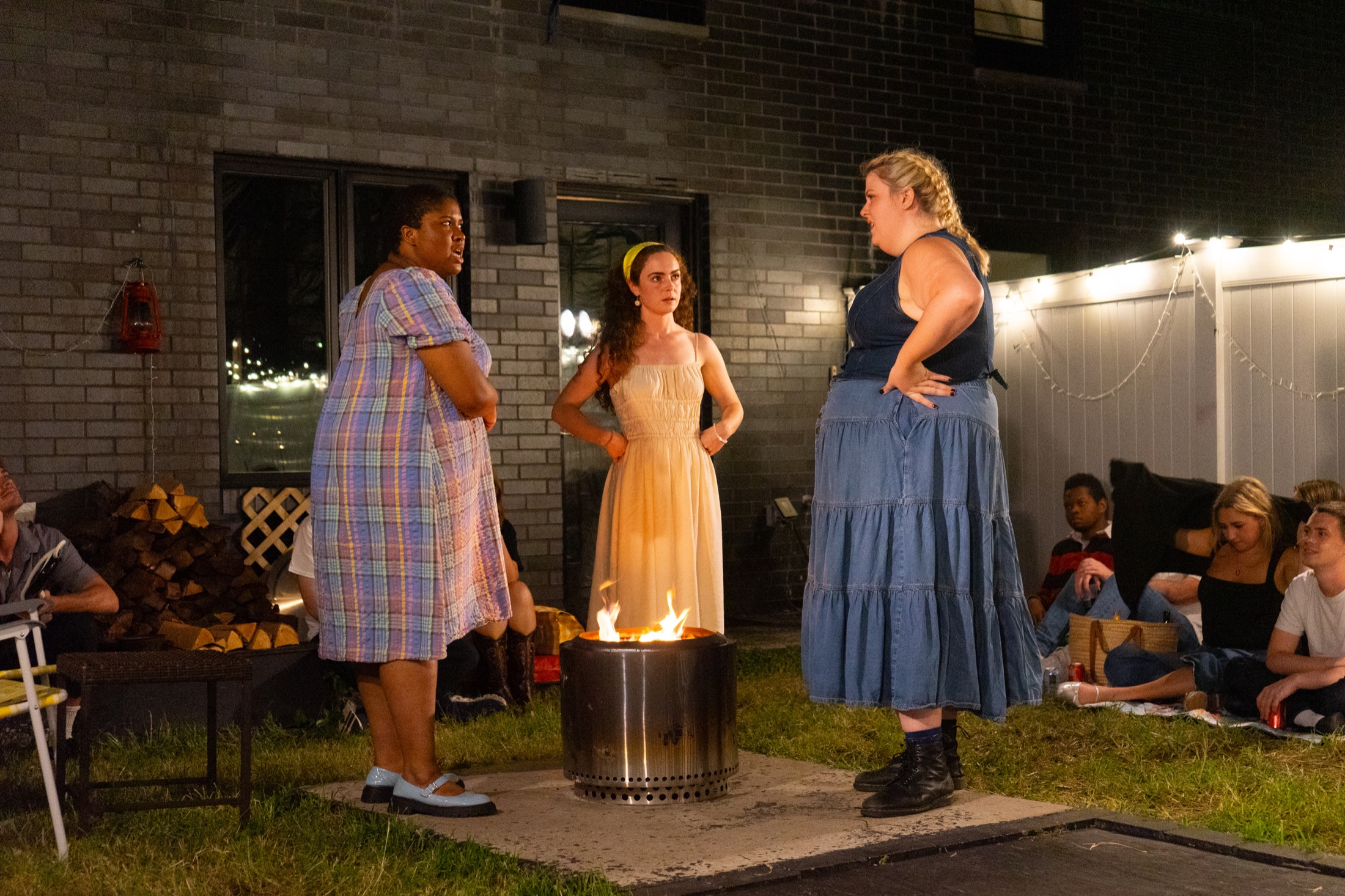 Emily Webb stands near the fire pit with Julia Gibbs and Myrtle Webb