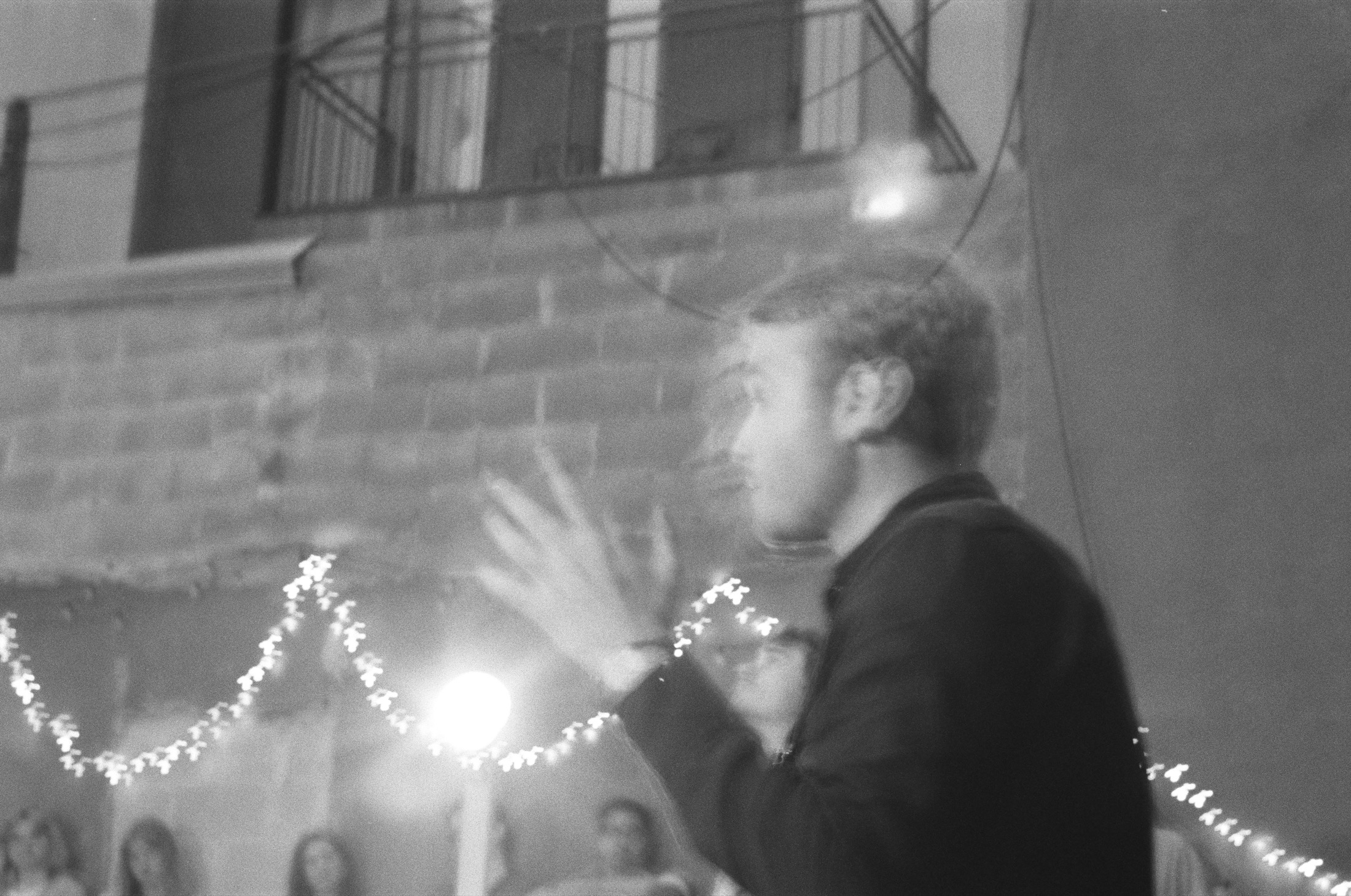 George and Emily face one another while the Stage Manager watches in black and white