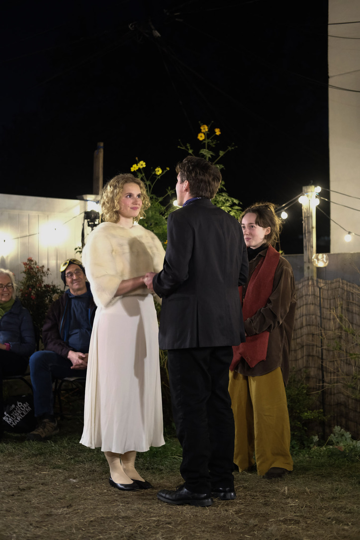 Romeo and Juliet stand together during the wedding scene