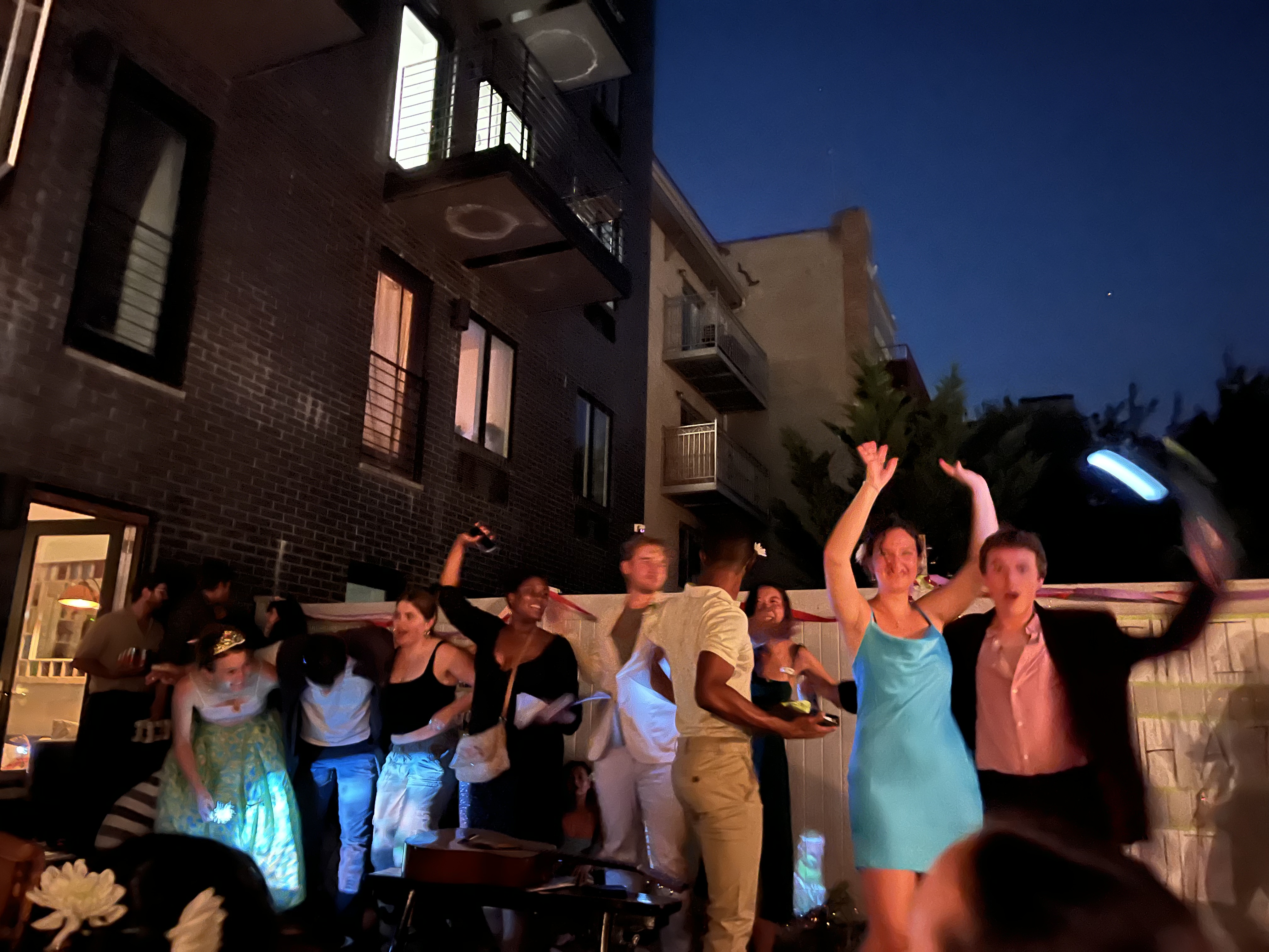 10 Things performers dancing and singing in a backyard at night