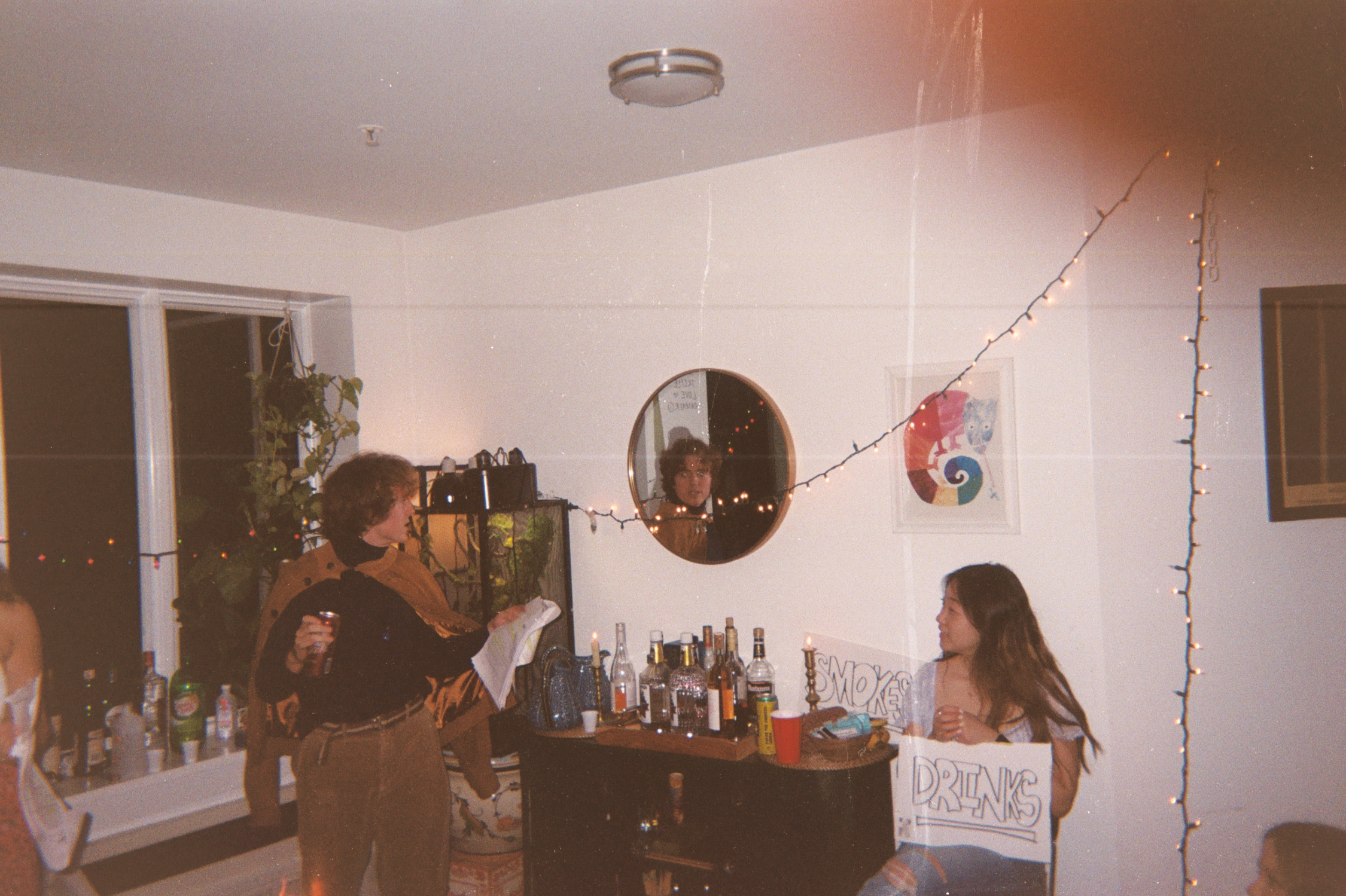 A moody first-production image from The Seagull with a handwritten Drink On sign