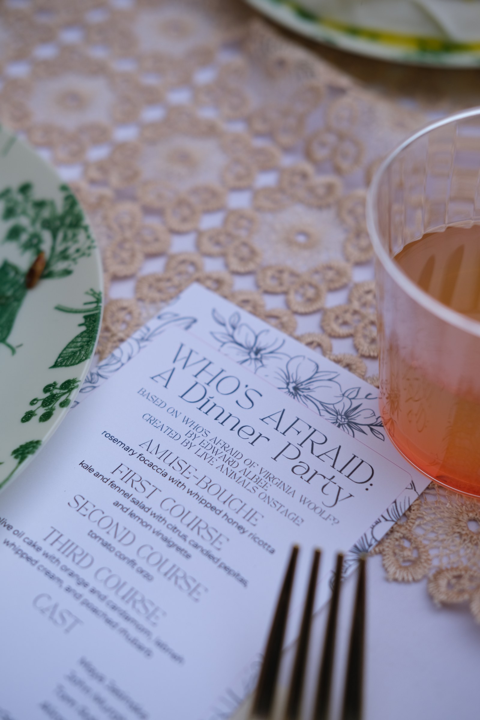 Who’s Afraid program and dinner menu on a lace tablecloth